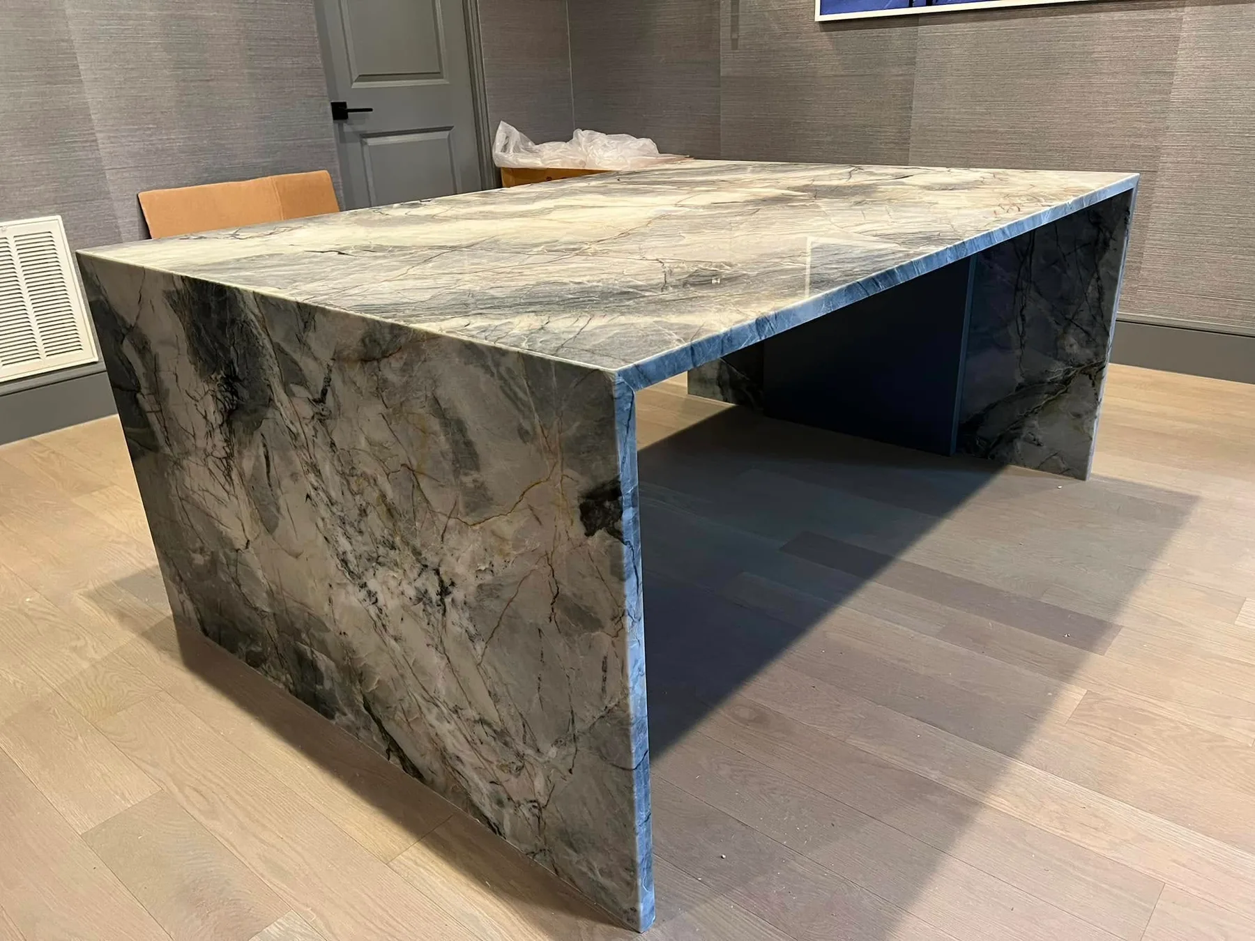Quartzite table built as a double-sided waterfall — Commercial