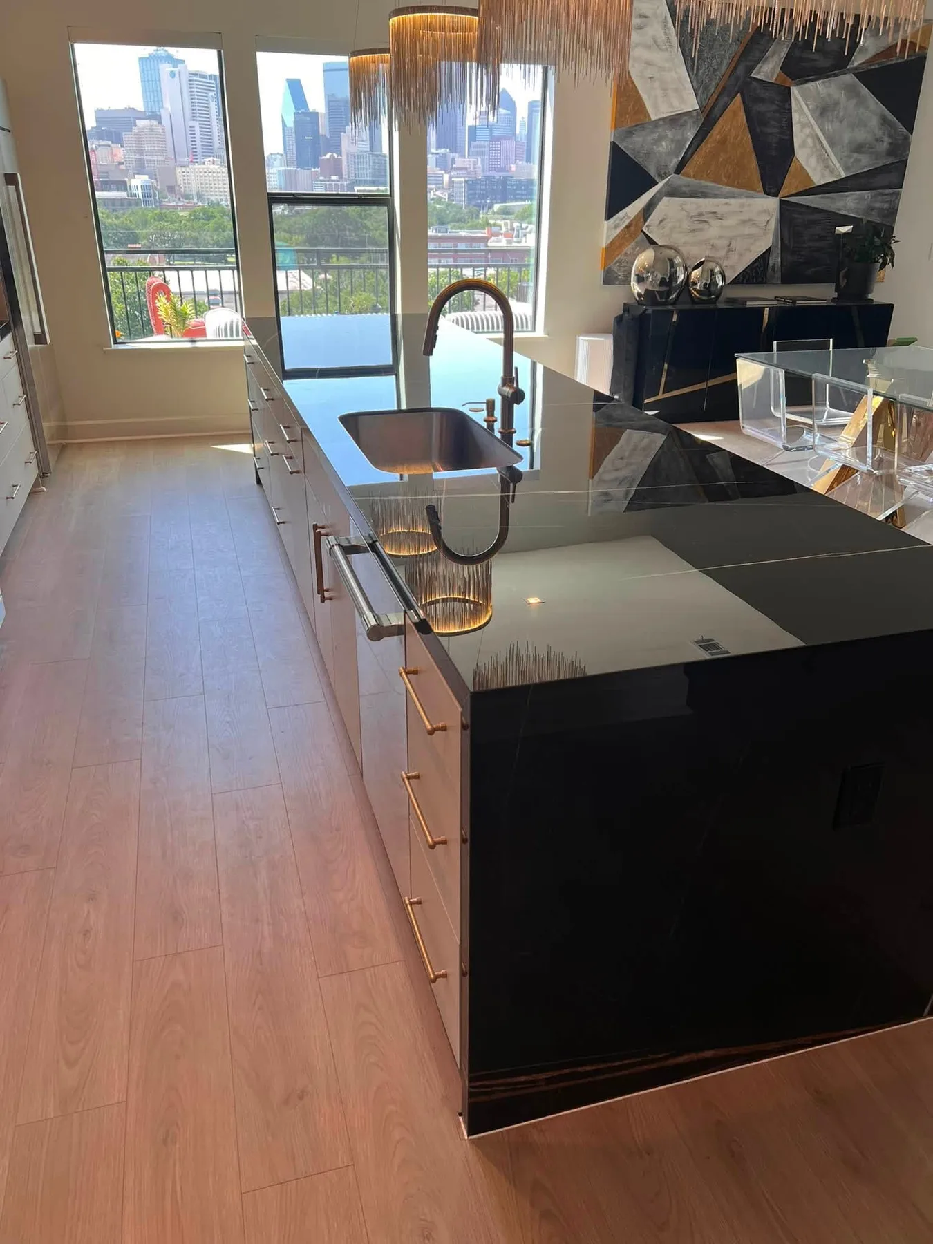 Black porcelain island with a mitred waterfall edge
