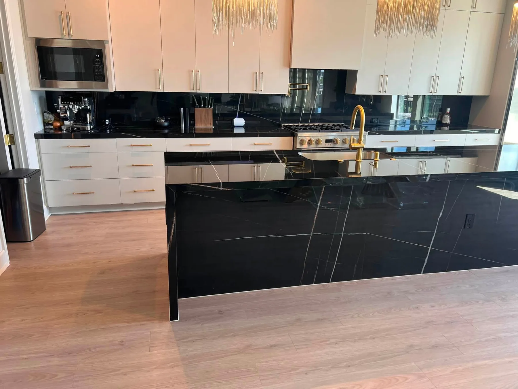 Black porcelain island and perimeter counters — Kitchen