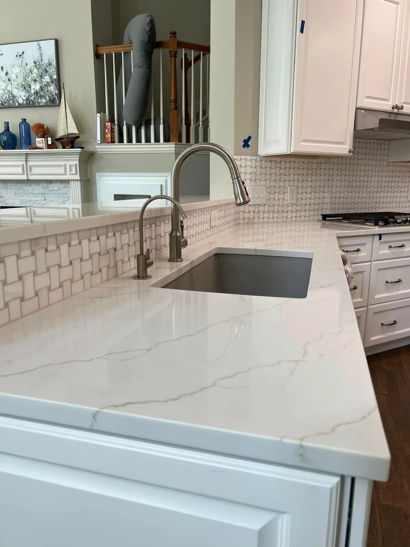 Eased-edge detail on a white quartz counter — Kitchen