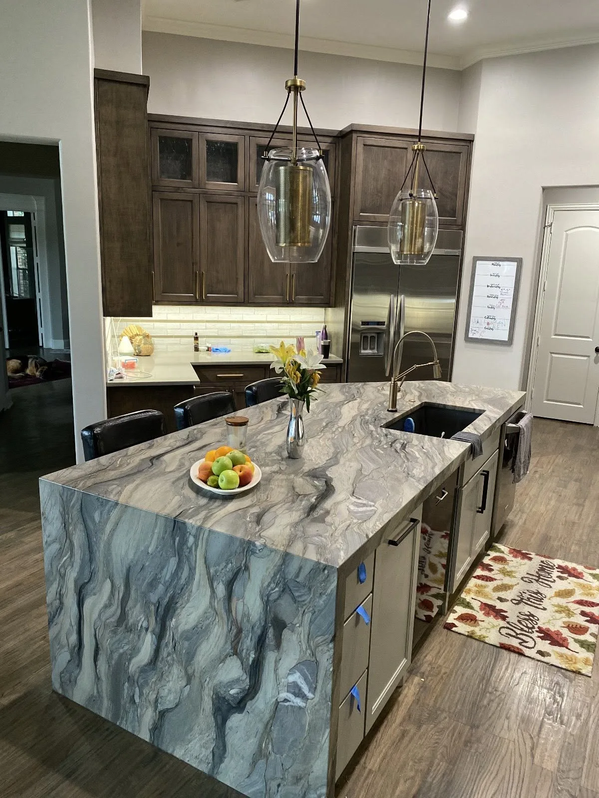 Quartzite island with a seating overhang — Kitchen